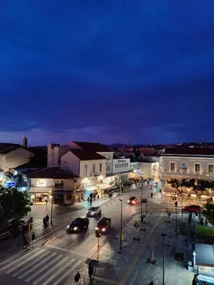 a city at night with cars on a street at Koukou Central Apt -Fast WIFI- 5' to Old Town in Chania Town