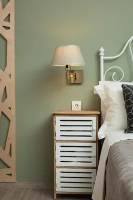 a bedroom with a bed and a nightstand with a lamp at Boutique Home -Splantzia-Roof Garden in Chania Town