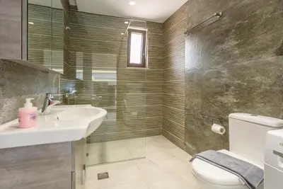 a bathroom with a sink and a toilet and a shower at Villa Lulla in Beritianá