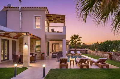 a villa with a view of the backyard at Villa Alexandros in Nopíyia