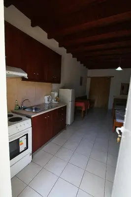 a kitchen with a sink and a stove top oven at Ledakis Studios in Frangokastello