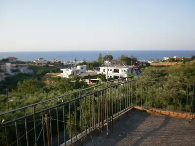 a view of the ocean from the balcony of a house at Pentari in Stalos