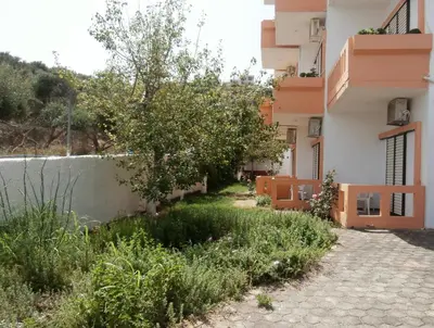 a garden in front of a building at Pentari in Stalos