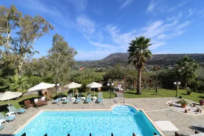 a pool at a resort with a view at Kalimera Apartments in Vamos