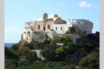 a large building on top of a mountain at Casa D'armaros in Kissamos