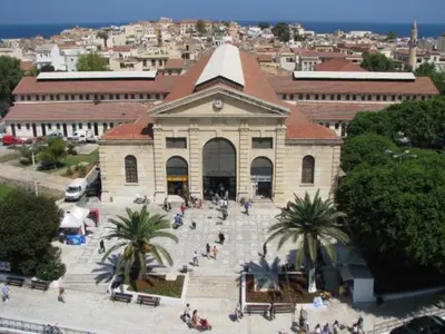 a building with a group of people in front of it at Meryland in Chania Town
