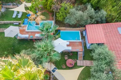 an aerial view of a house with a swimming pool at Chania Green House 1 in SFakianalíon