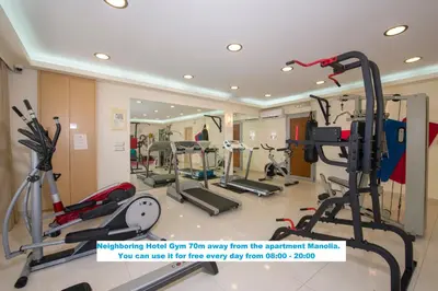 a gym with treadmills and elliptical machines at Manolia Dream Apartment 3-bedrooms 30m to the beach in Agia Marina Nea Kydonias