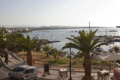 a car parked on a street next to a body of water at Semeli Studios in Chania Town