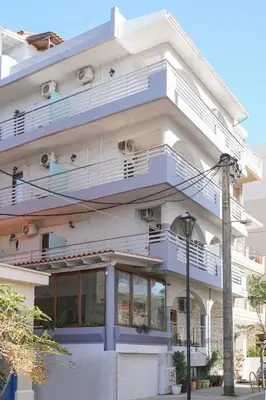 a building with balconies on the side of it at Posidonio Hotel in Chania Town