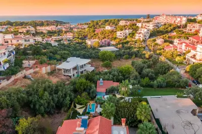 an aerial view of a city with houses and the ocean at Chania Green House 2 in Aghii Apostoli
