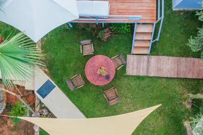 an overhead view of a yard with chairs and a table at Chania Green House 2 in Aghii Apostoli