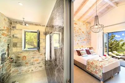 a bedroom with a shower and a bed in a room at Villa Vardis Heated Pool in Vryses