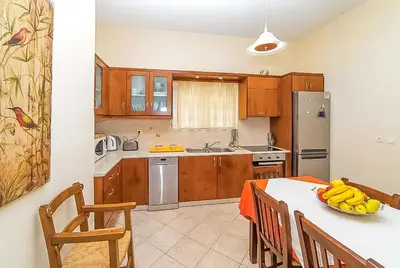 a kitchen with a table with bananas on it at Villa Panagiotis Chania in Daratso