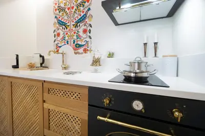 a kitchen with a stove and a sink at Kallinikou Residence - private parking on demand - in Chania Town