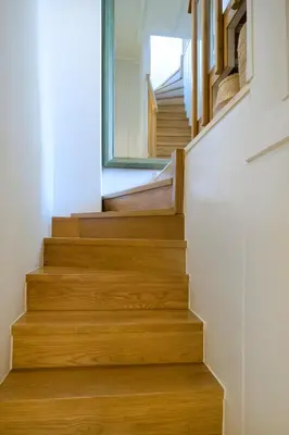 a staircase in a house with wooden floors at Kallinikou Residence - private parking on demand - in Chania Town