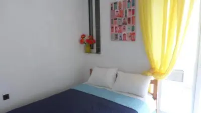 a room with a bed with a yellow curtain at Summer Holidays Studio in Chania Town
