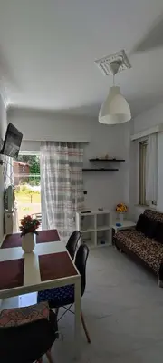 a living room with a table and a couch at Top Holidays Apartments in Chania Town