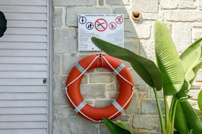 an orange lifesaver is attached to a brick wall at Villa Vasiliki in Stalos