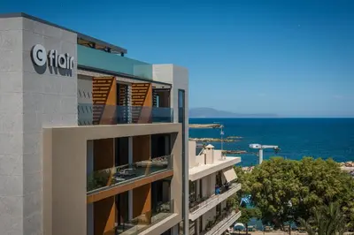 a view of a building with the ocean in the background at Chania Flair Boutique Hotel, Adults only, Tapestry Collection by Hilton in Chania Town