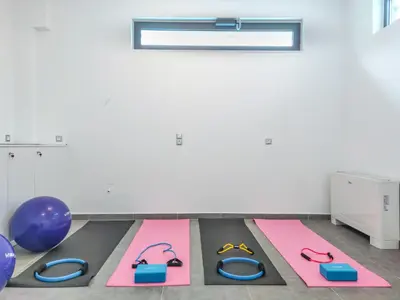 a gym with pink and blue mats and purple balls at Villa Darazzo with Private Pool in Daratso