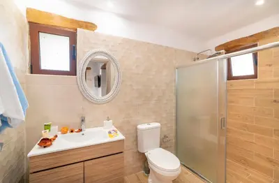 a bathroom with a toilet and a sink and a shower at Cretan Lux Villa Heated Pool in Gavalochori