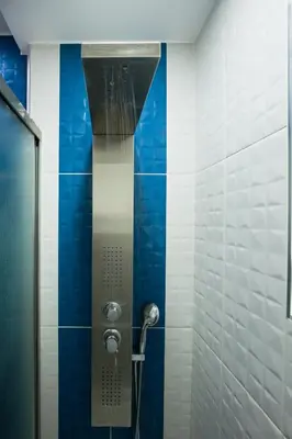 a shower stall with blue and white tiles at Larimar Luxury Sea View Villa in Kissamos