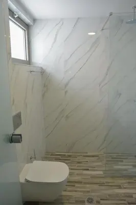 a white bathroom with a toilet and a shower at Southern Paradise Villas - Private Pool in Kalamaki Chanion