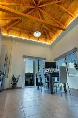 a dining room with a table and chairs at Creta Galini House in Sirílion