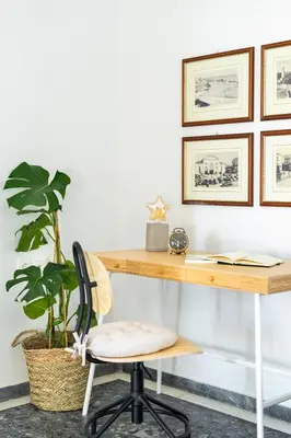 a desk with a chair and a plant at Sea City and Mountain View Apartment in Chania Town