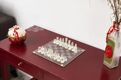 a chess board on a table next to a vase at Vista del Puerto in Chania Town