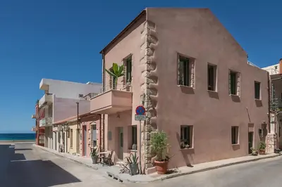 a building on the side of a street at Koum Kapi Boutique Apartments in Chania Town