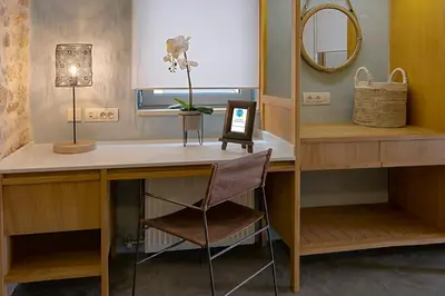 a dressing room with a desk and a mirror at Koum Kapi Boutique Apartments in Chania Town