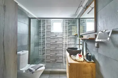 a bathroom with a shower and a toilet and a sink at Seaside House in Kissamos