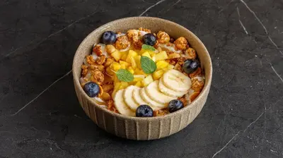 a bowl of food with fruit and nuts on a table at Centro Storico in Chania Town