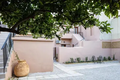 a vase sitting on the side of a building at Centro Storico in Chania Town