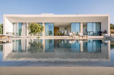 a house with a pool in front of it at Ellas Residence fantastic pool heated in Kissamos