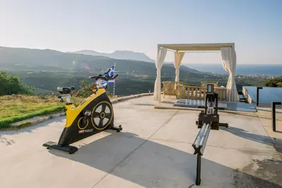 a camera on a tripod next to a table with a view at Ellas Residence fantastic pool heated in Kissamos
