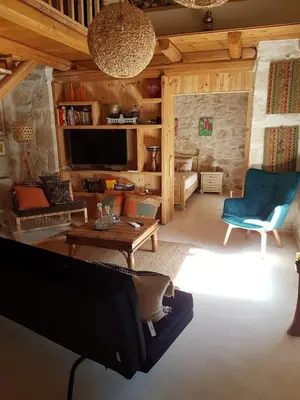 a living room with a couch and a table at Old stone villa in Apokoronas Villa Nostalgia Kreta in Fílippos