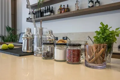 a counter with several jars of condiments on it at SanSal Boutique Hotel in Chania Town