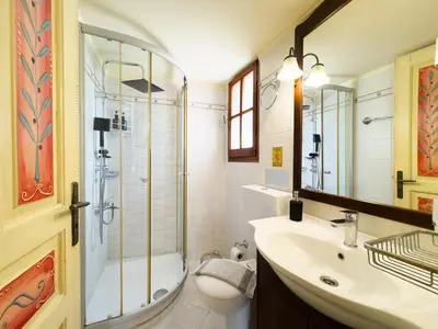 a bathroom with a shower and a sink at Villa Eleni Seaside Apartments in Plataniás