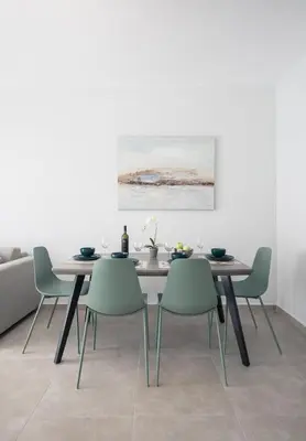 a dining room with a table and four chairs at Casa Ntore Luxury Apartments in Chania Town