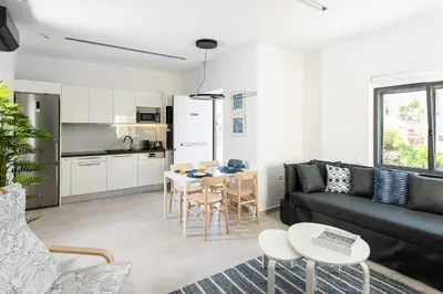 a living room with a couch and a table at Cozy Corner Luxury Apartments in Chania Town