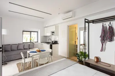a living room with a couch and a table at Cozy Corner Luxury Apartments in Chania Town