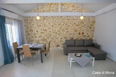 a living room with a couch and a table at Casa di Mona in Chania Town