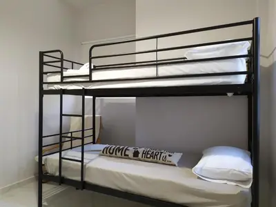 a couple of bunk beds in a room at Sunday Apartment Chania 2B in Chania Town