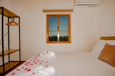 a bedroom with a bed with red hearts on it at Trouli Rokka House in Kissamos