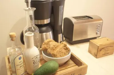 a counter with a blender and a bowl of bread and a toaster at Charming Studio in the Old Town in Chania Town