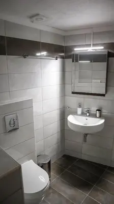 a bathroom with a sink and a toilet at Casa Dasyra in Chania Town