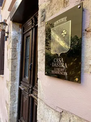 a sign on the side of a building at Casa Dasyra in Chania Town